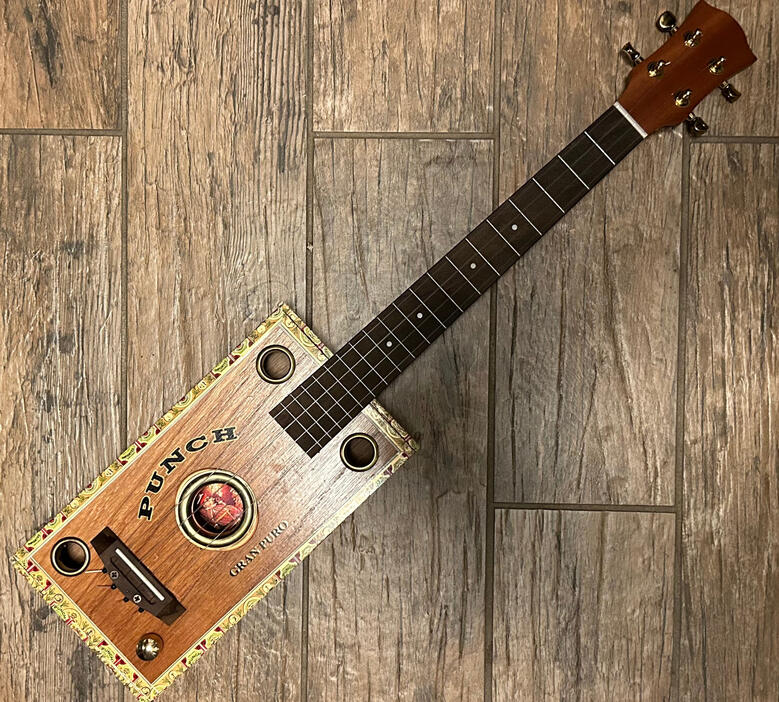 A photo of a Cigar Box Uke created by Ray Riordan