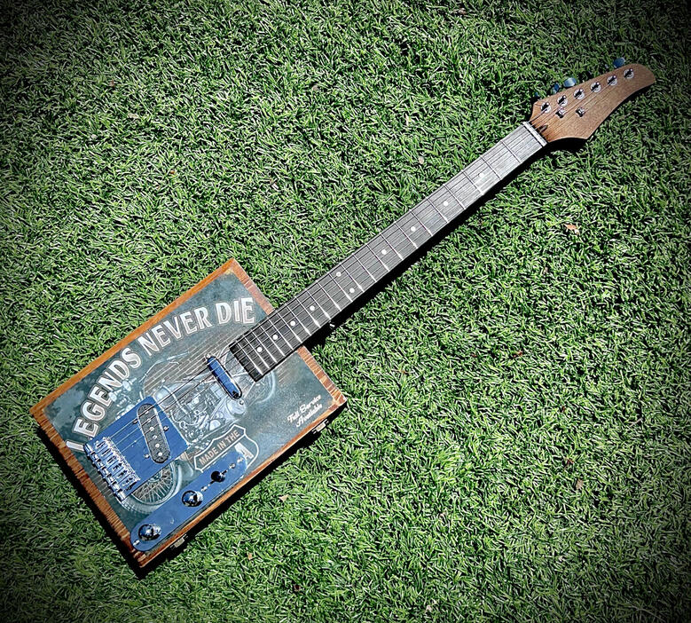 A photo of a Cigar Box Guitar created by Ray Riordan