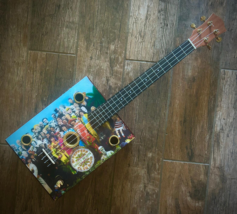 A photo of a Cigar Box Uke created by Ray Riordan
